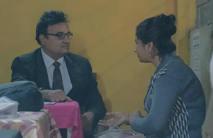 Discussion between field staff and local leader