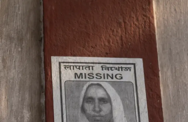 Missing person poster on wall